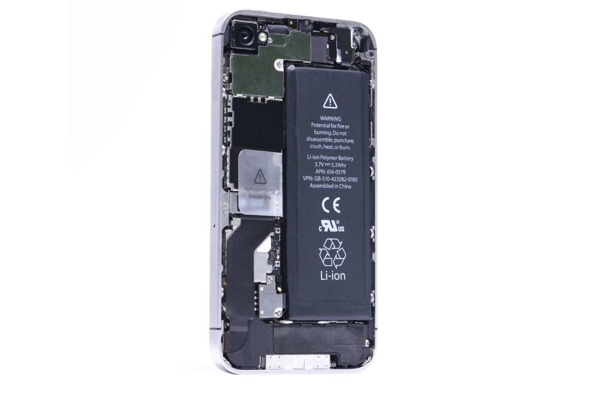 Opened iPhone showing the battery and logic board during a Brooklyn repair